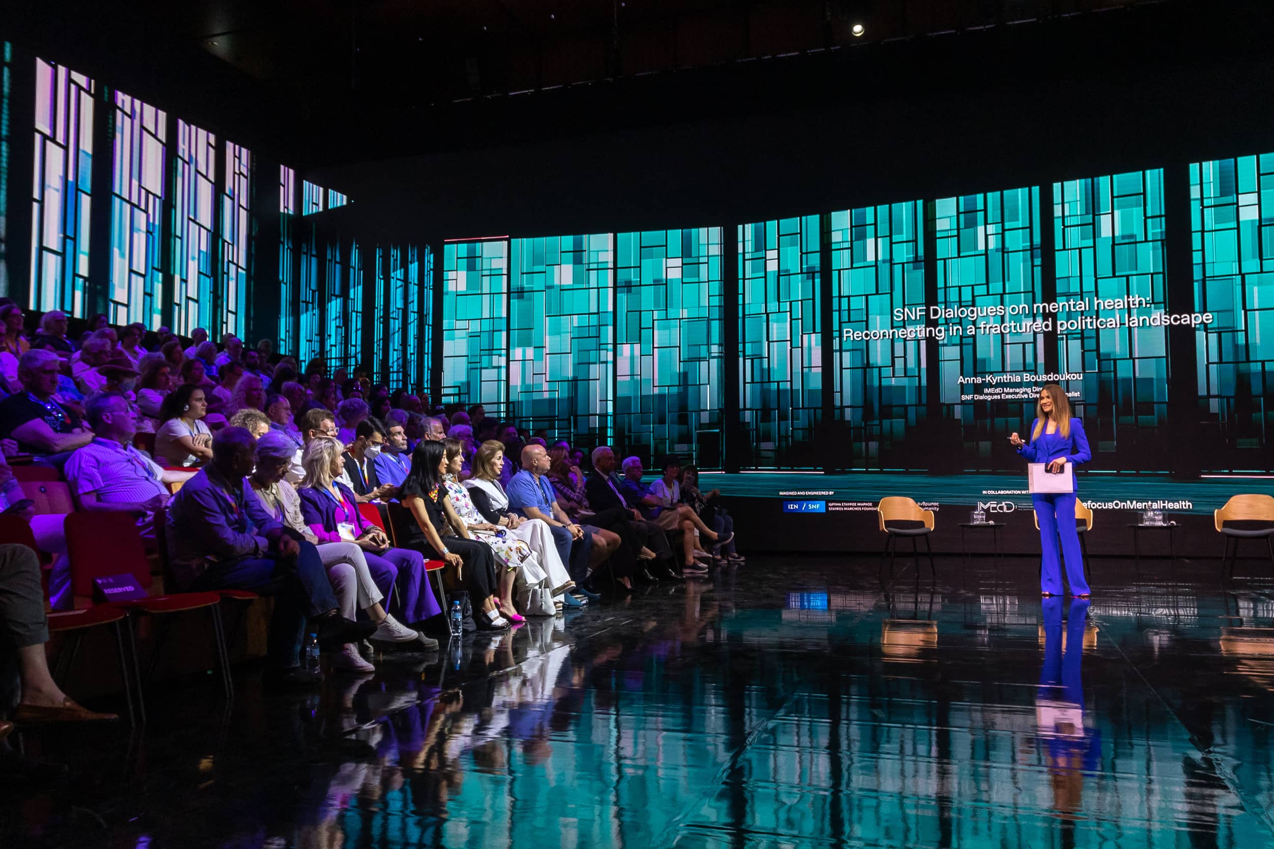 Anna Kynthia Bousdoukou speaking to the audience at the SNF Dialogues event.