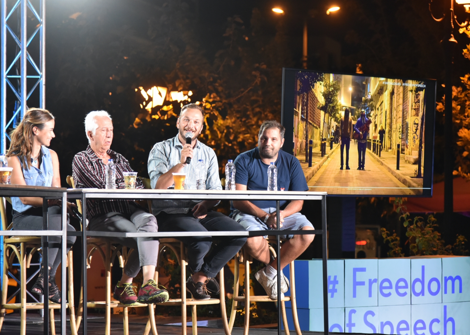 Anna Kynthia Bousdoukou and three guest speakers on stage at the SNF Dialogues event.