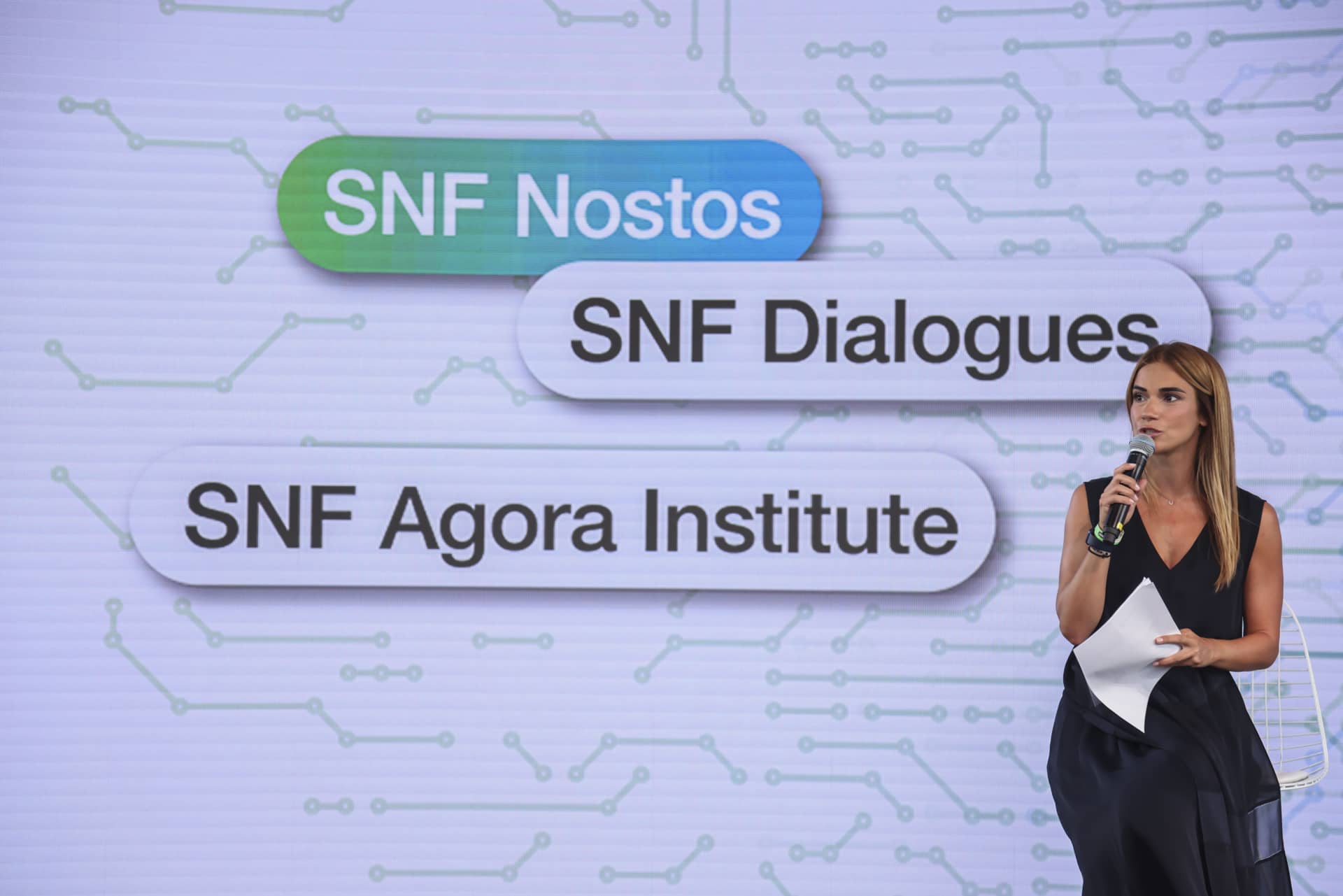 Anna Kynthia Bousdoukou on stage at the SNF Dialogues event.