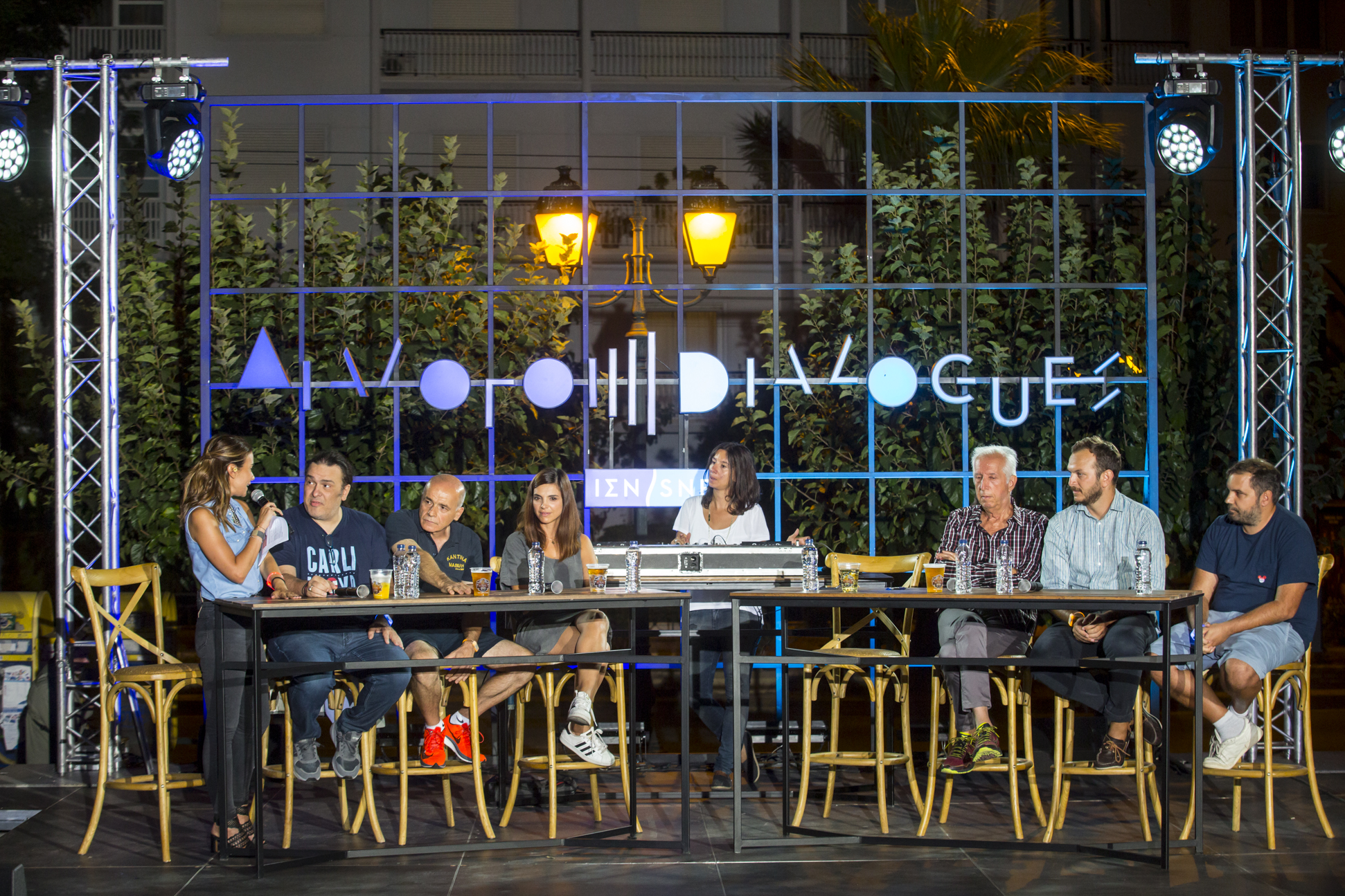 Anna Kynthia Bousdoukou and a group of speakers sitting at a table at the SNF Dialogues event.