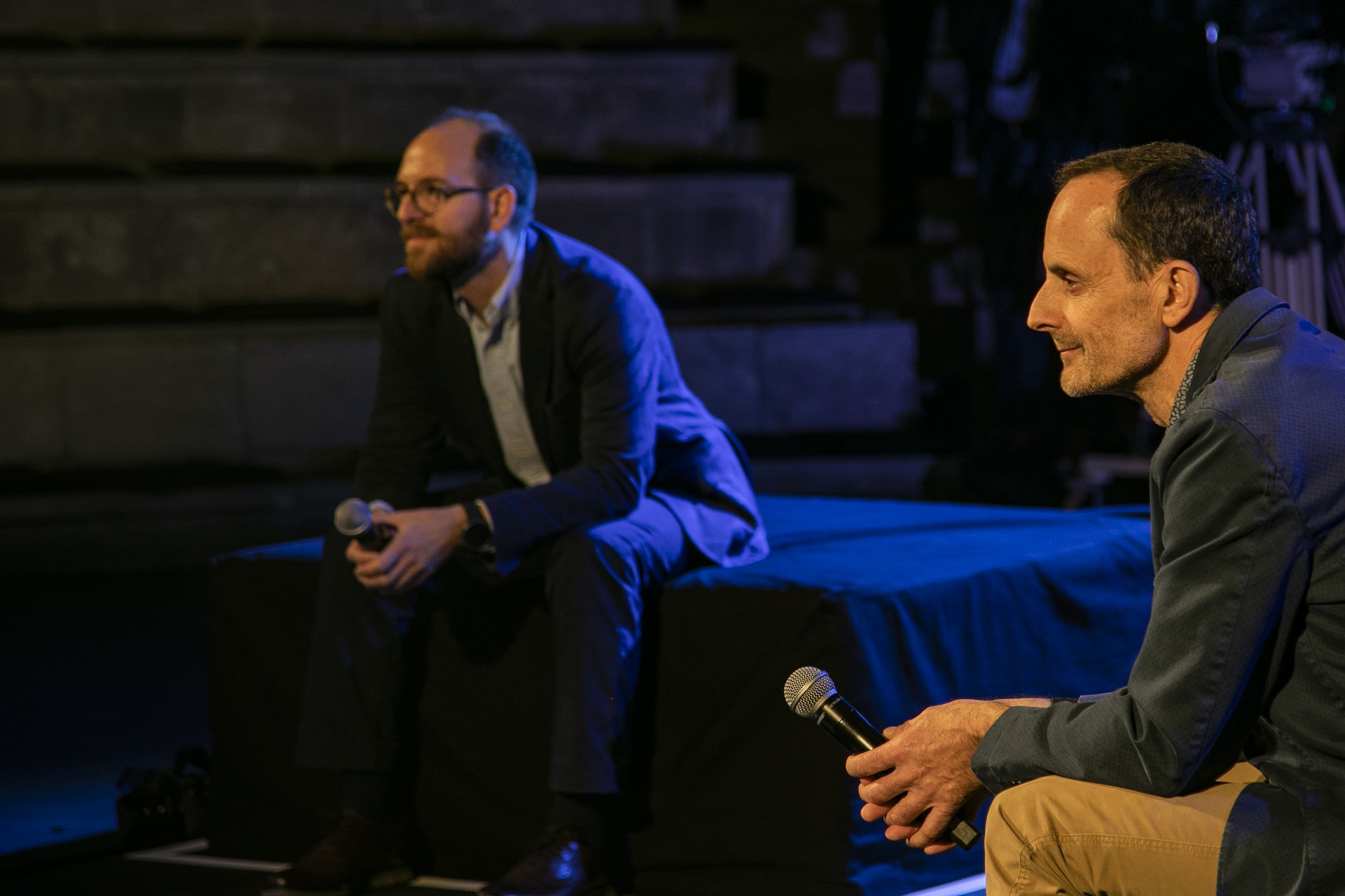 Two speakers holding the mic at the SNF Dialogues event.