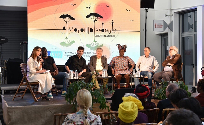 Anna-Kynthia Bousdoukou with other guests on stage at the SNF Dialogues event