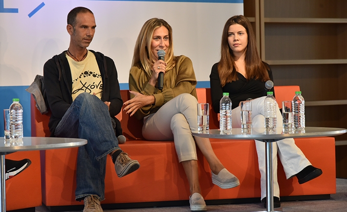 Three speakers sitting on a couch  at SNF Dialogues event.