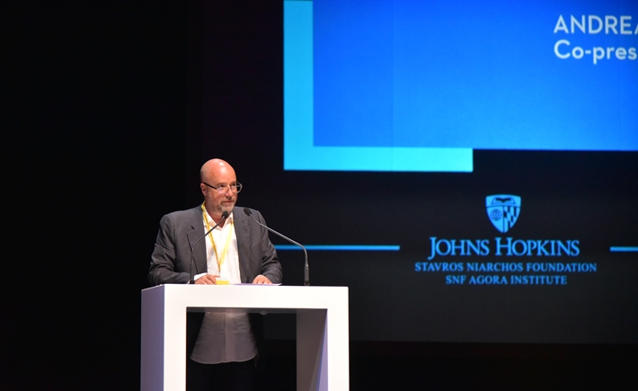 SNF Co-president A. Drakopoulos on stage at the SNF Dialogues event.