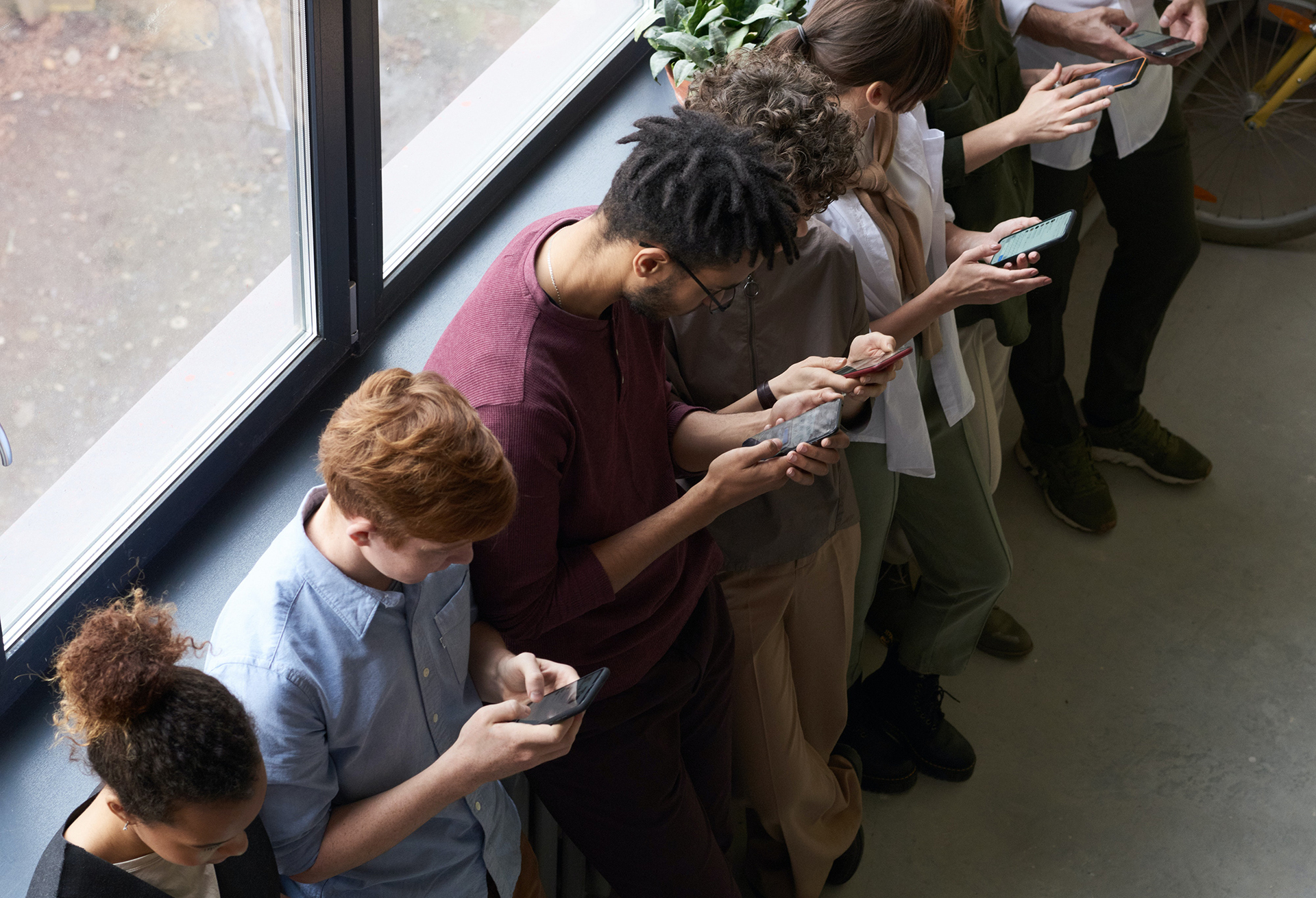 People looking at their phones with full attention.