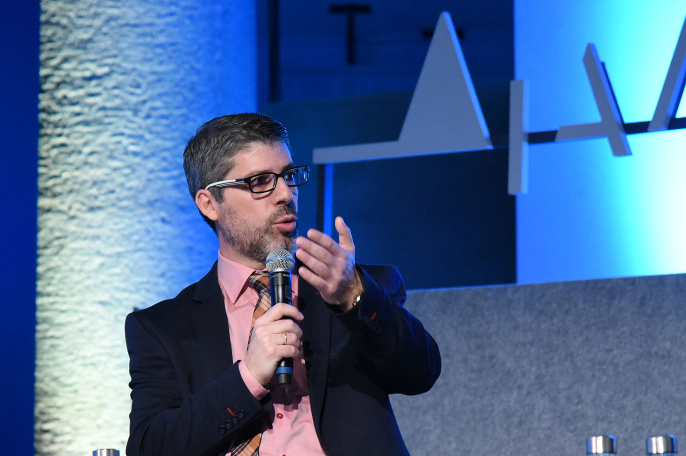 A man speaking at the SNF Dialogues event