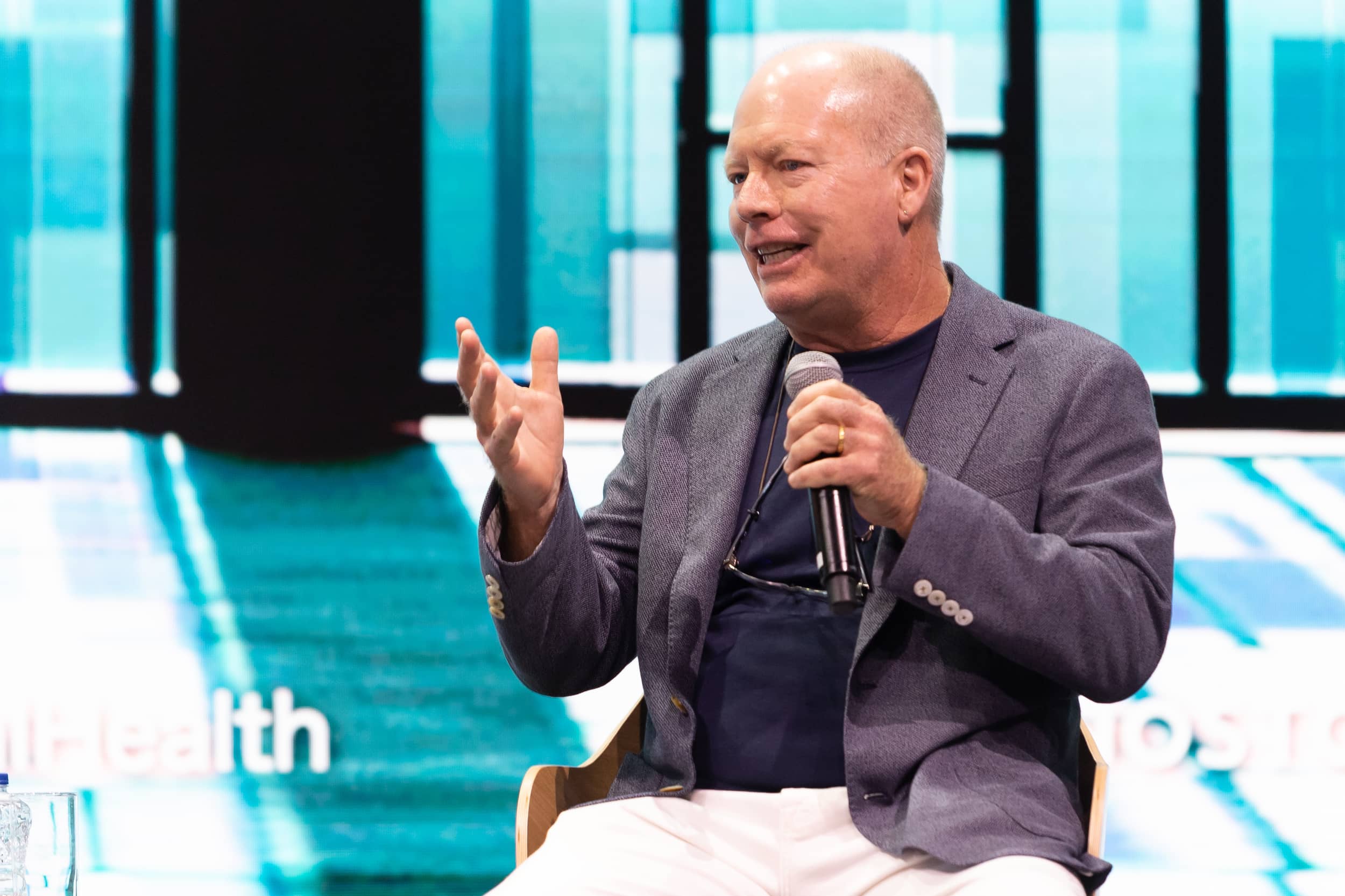 Man speaker holding the mic at the SNF Dialogues event.