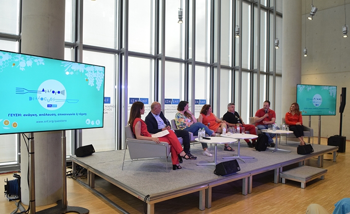 Seven speakers on stage at the SNF Dialogues event.