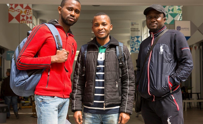 Three men posing for a photo