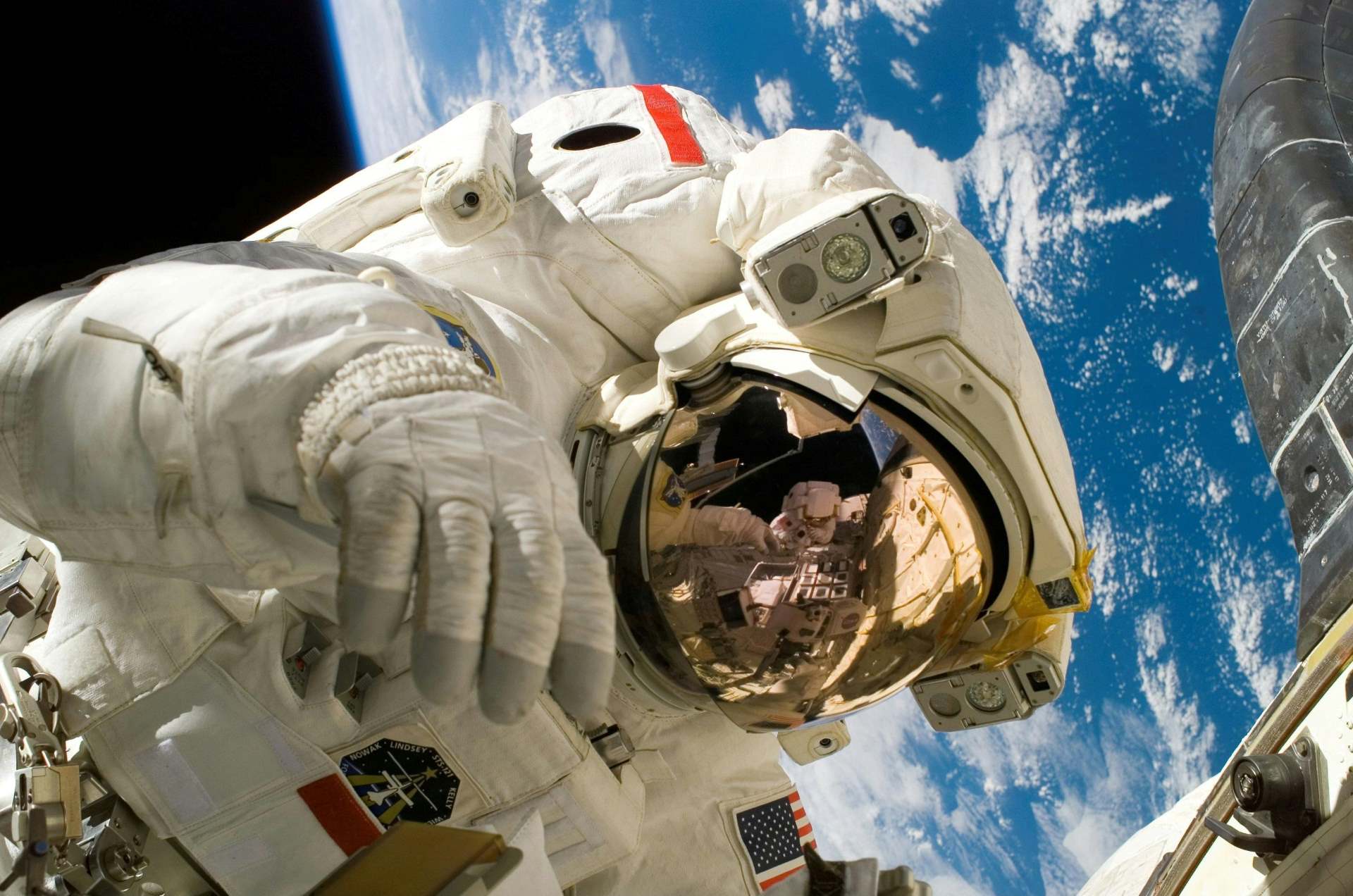 An astronaut floats in space.