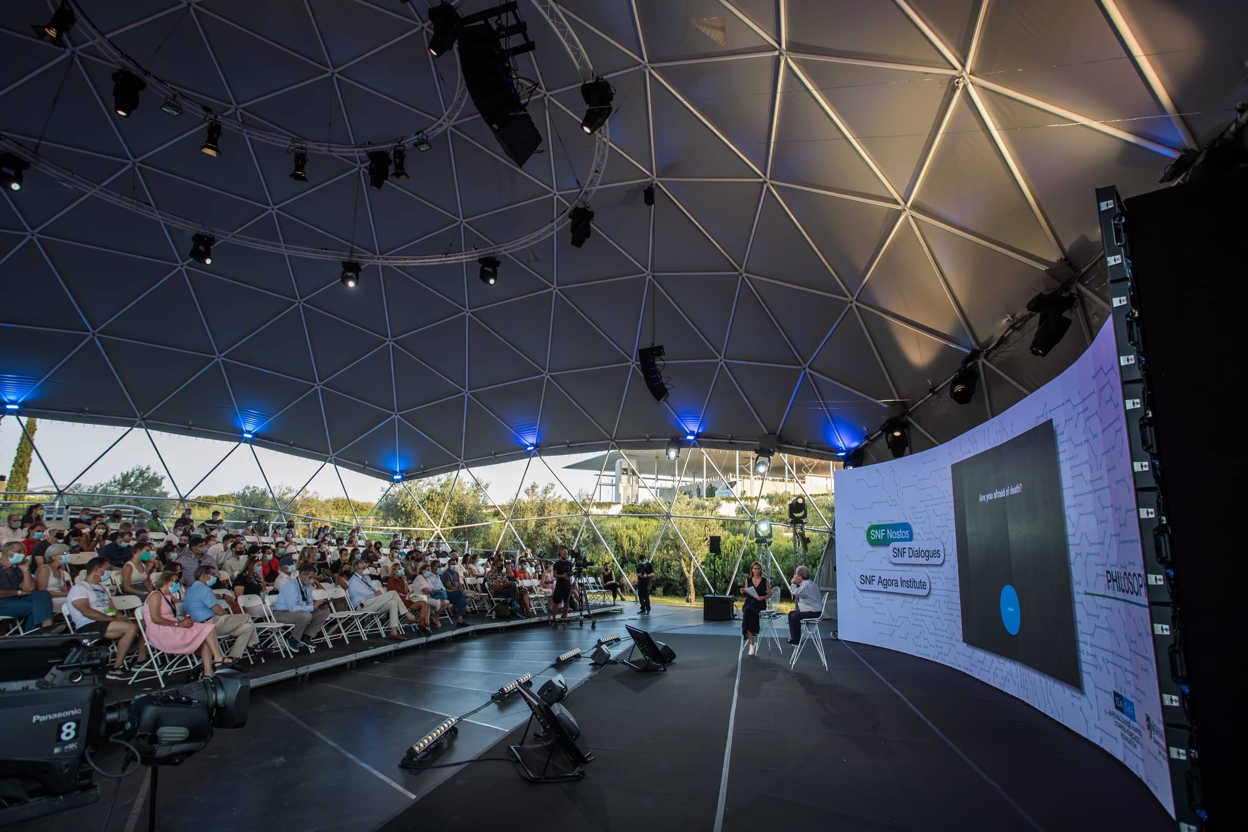 Audience at the SNF Dialogues looking at stage where there are the speakers.